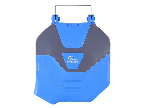 A roll of automatic rewind hose reel under a white background