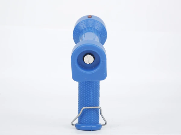 Side view of the brass water gun with a blue exterior