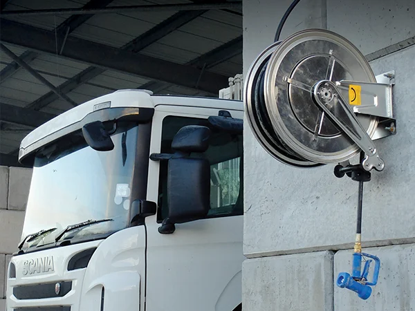 Hose-free food grade stainless steel reel mounted on the wall of automotive repair shop