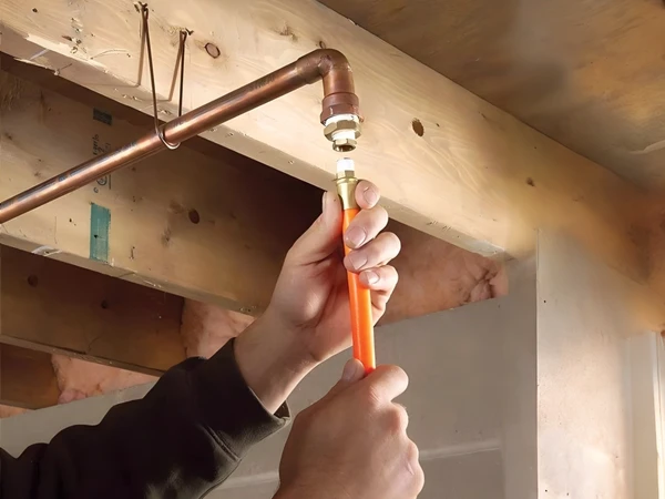 A person is preparing to connect the reinforced PU air hose to the pipeline
